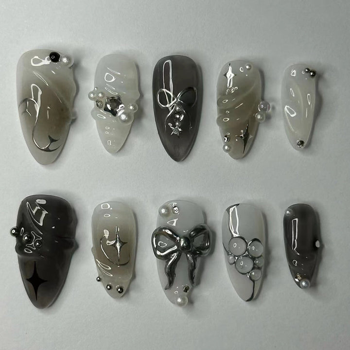 Elegant artificial nails with modern design and glitter accents Bowlift