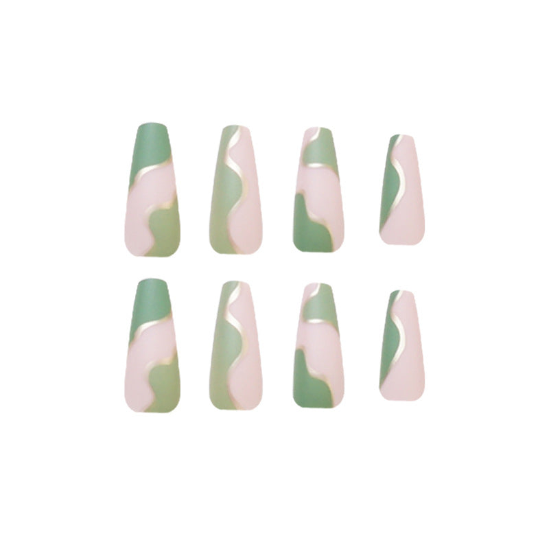 Artful Gel Nails with Elegant Wave Design and Gold Accents Bowlift