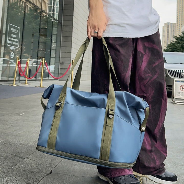 Sporty shoulder bag with water-repellent material and sturdy carrying handles Bowlift