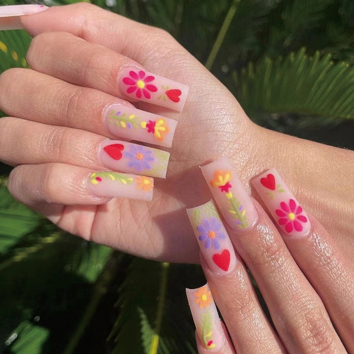 Artful Gel Nails with Elegant Floral Design and Glitter Accents Bowlift