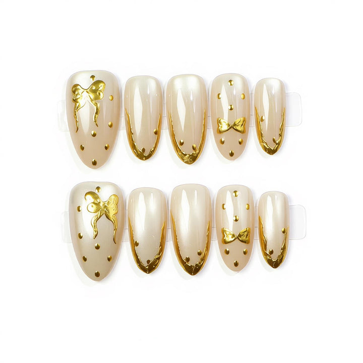 Elegant Press-On Nail Art with Golden Bow Accents Bowlift