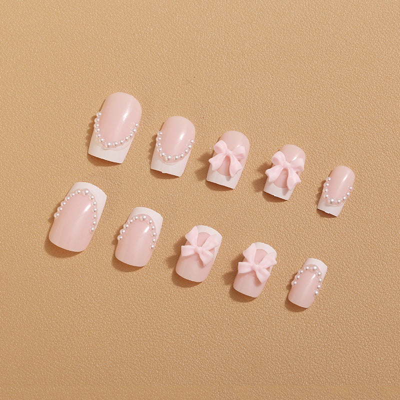 Artificial nail tips with elegant bows and pearl decorations Bowlift