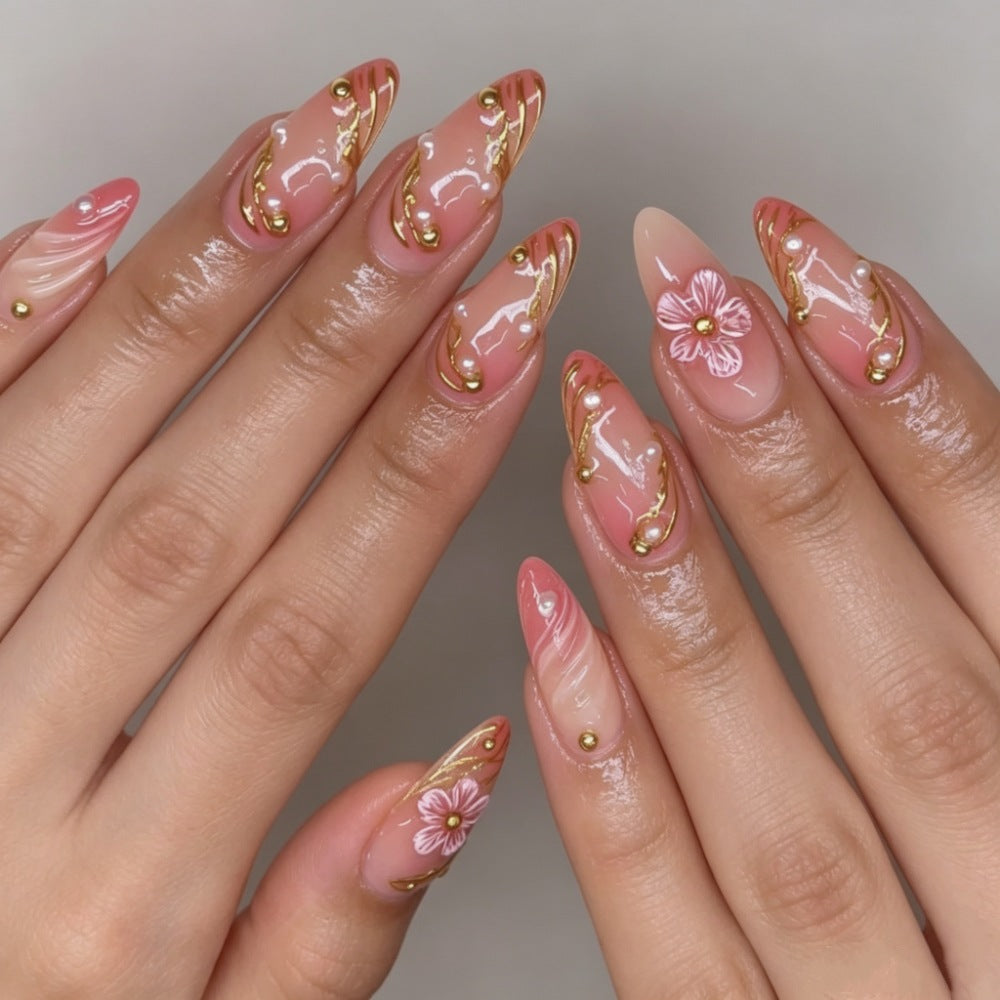 Artificial nails with floral decorations and gold accents Bowlift