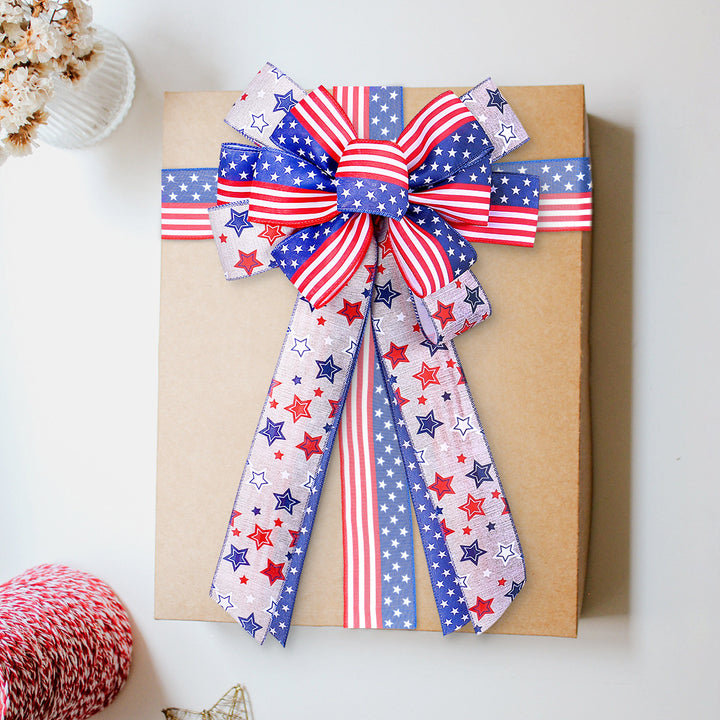 Unisex decorative bow made of sturdy ribbon with star and stripe pattern Bowlift