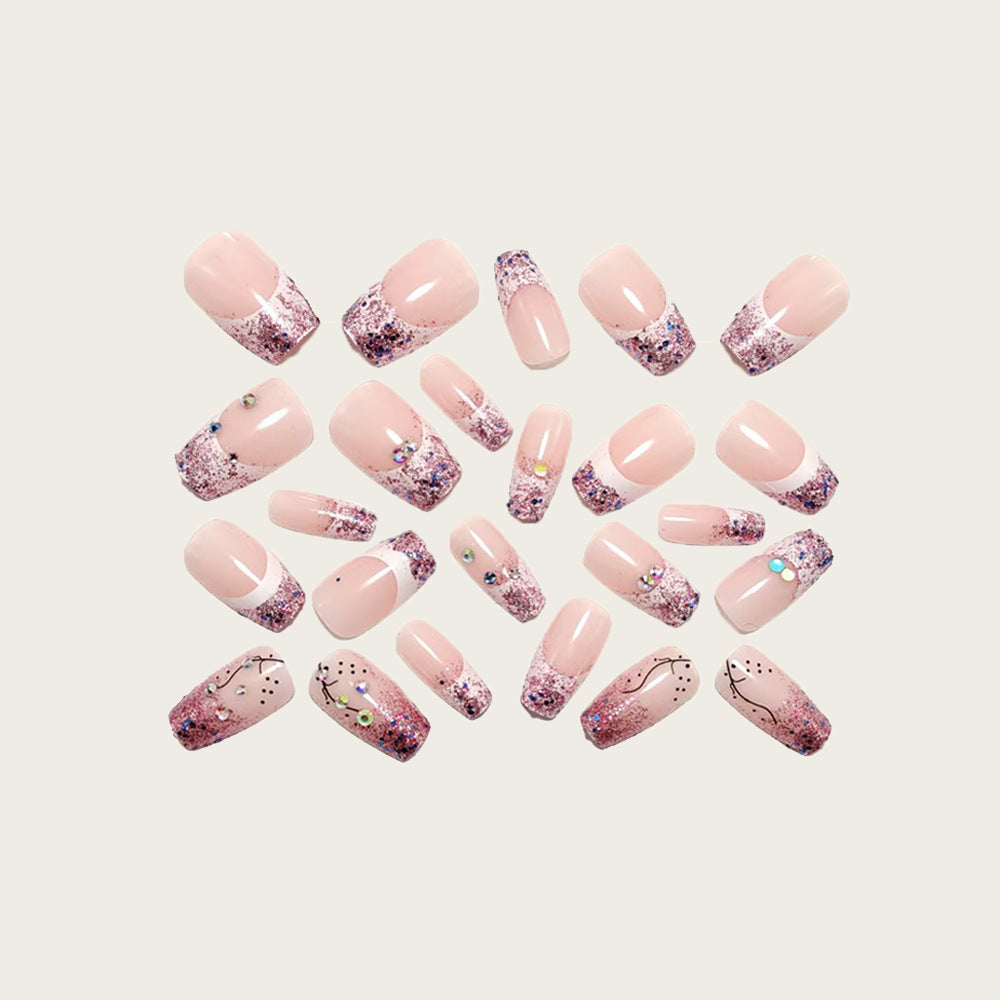 Glamorous artificial nails with glitter and rhinestone embellishments Bowlift