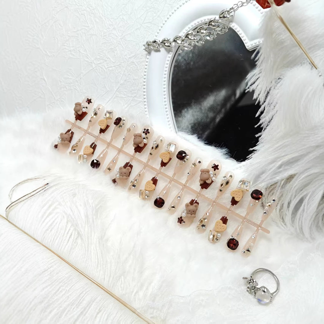 Creative acrylic nails with animal motifs and glitter accents Bowlift