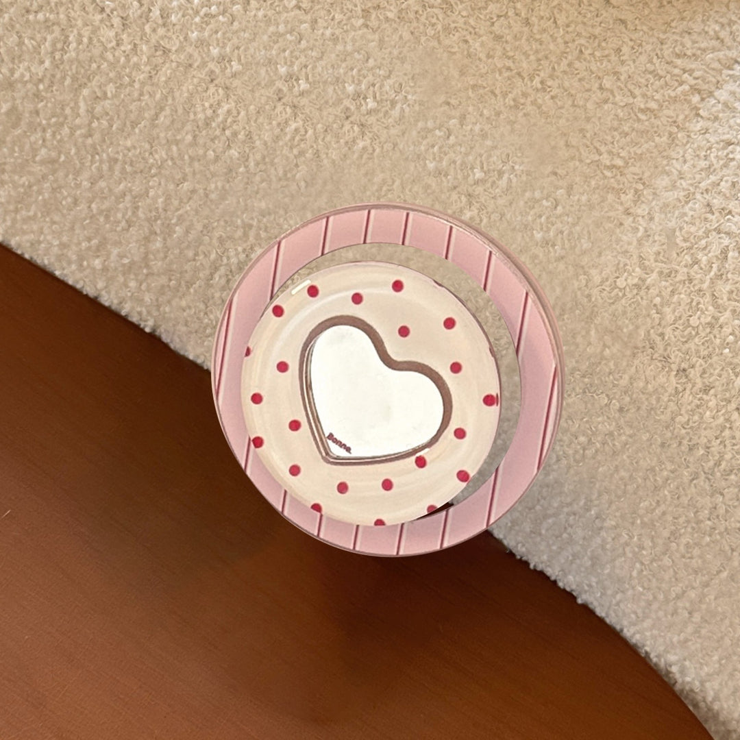Heart-shaped coaster with playful design Bowlift