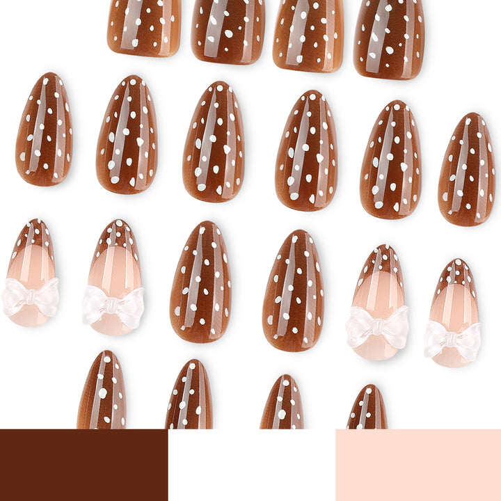 Artistic stiletto nails with delicate bow motif Bowlift