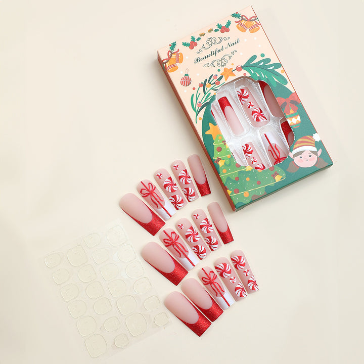 Artificial nail set with festive candy cane design and glitter accents Bowlift