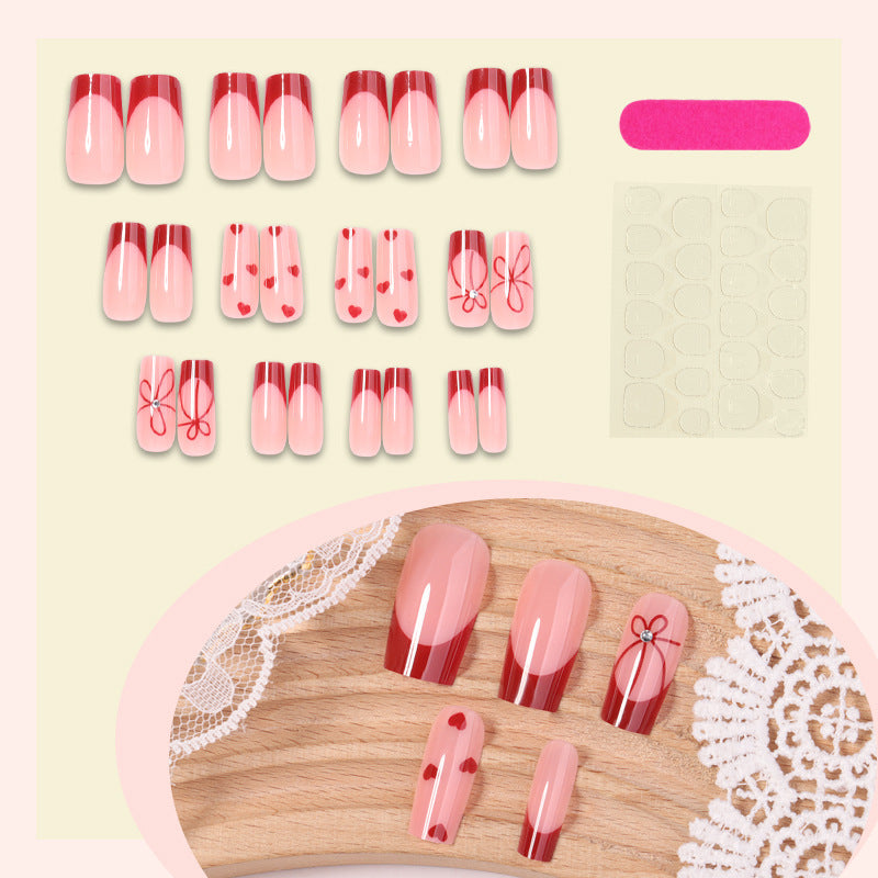 Artificial nail set with romantic hearts and elegant bows Bowlift