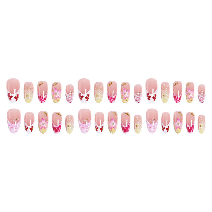 Artificial nails with floral accents and glitter decorations Bowlift