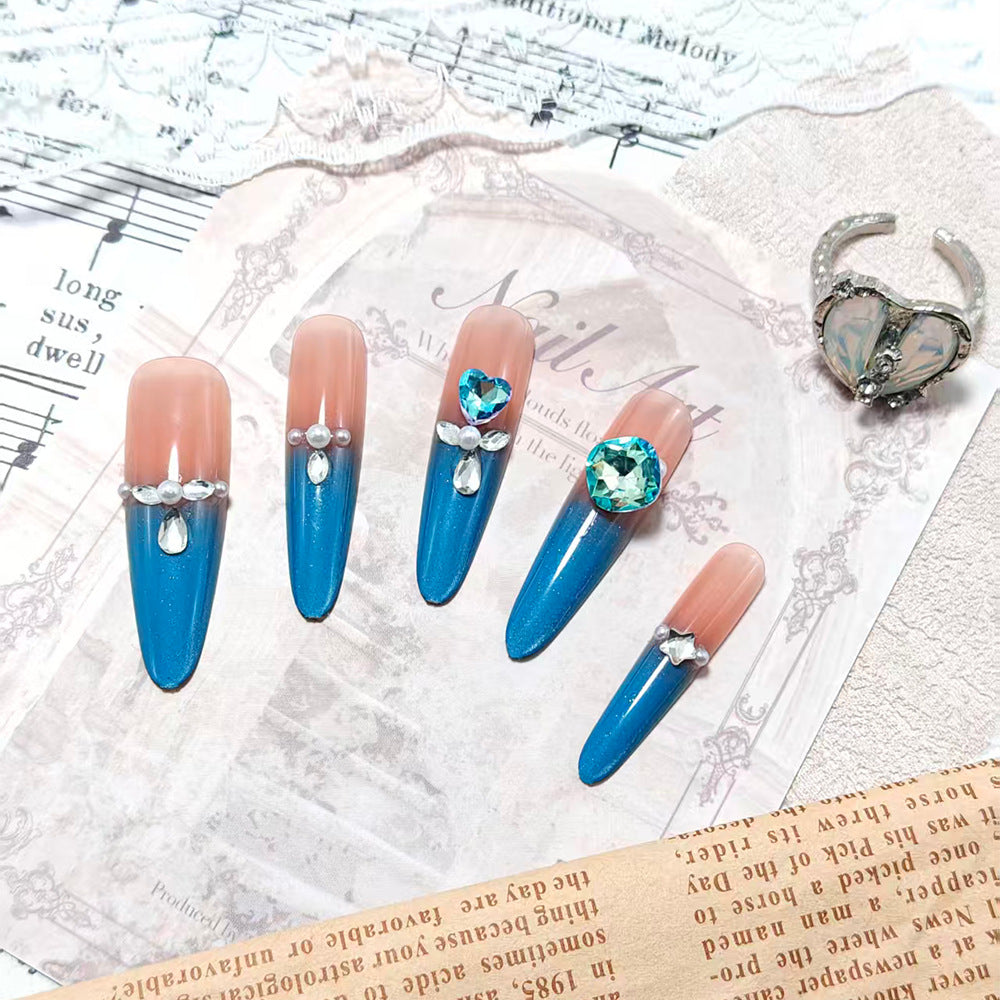 Artificial nails with glitter and rhinestone embellishments Bowlift