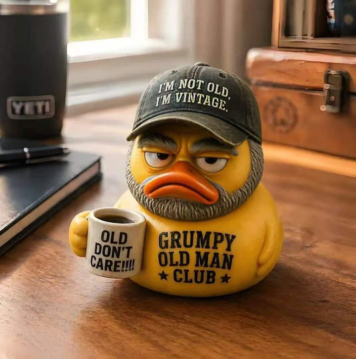 Funny rubber duck with vintage hat and cup Bowlift