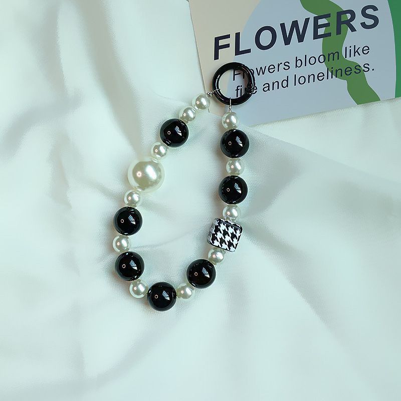 Elegant Pearl and Black Bead Charm Bracelet Bowlift