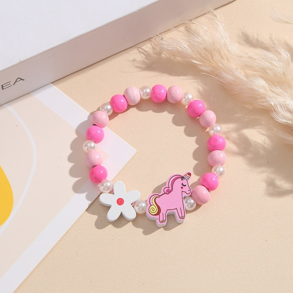 Playful children's bracelet with unicorn and flower motif Bowlift