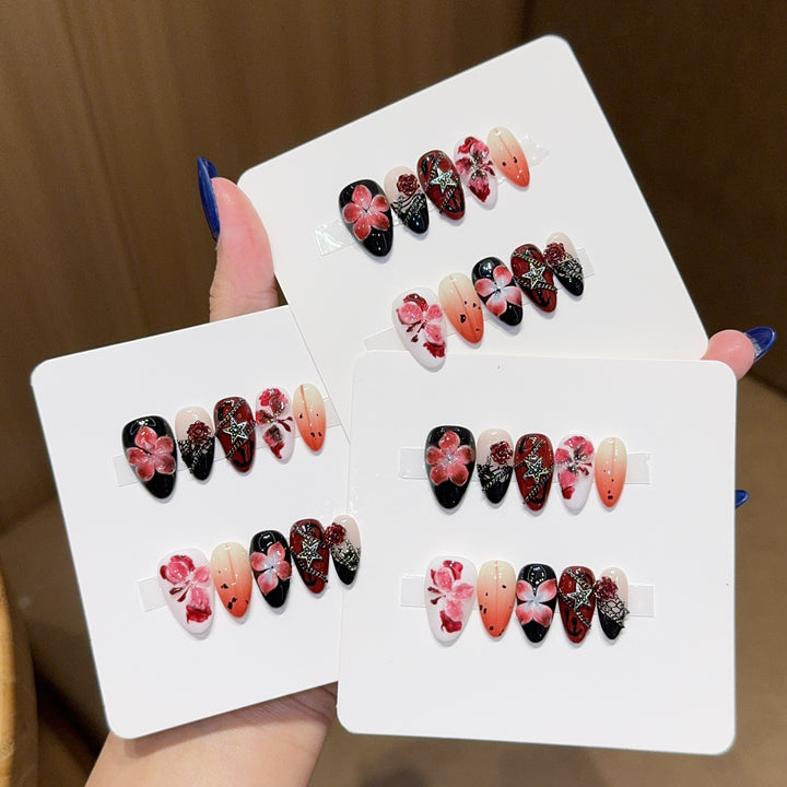 Art nail set with floral motifs and glitter accents Bowlift