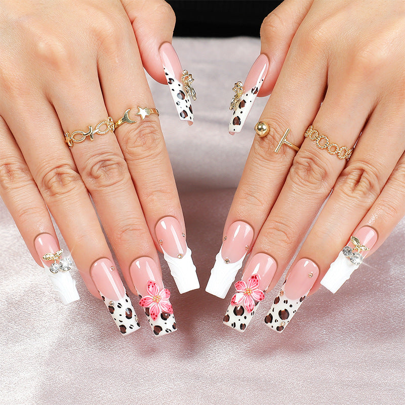 Acrylic nail set with elegant leopard design and floral accents Bowlift