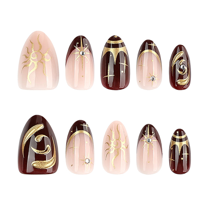 Artful nail art with golden accents and mystical motifs Bowlift