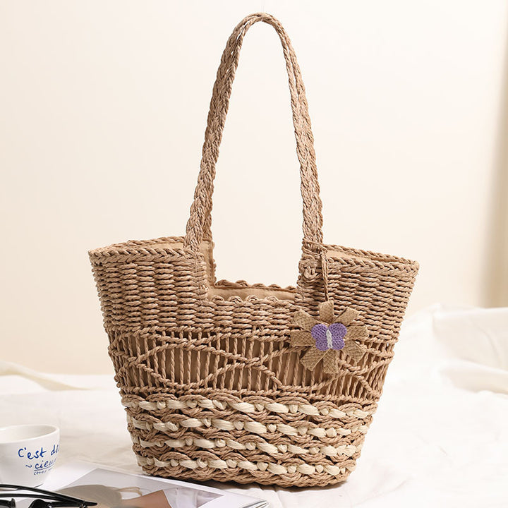Braided basket bag with decorative flower appliqué Bowlift
