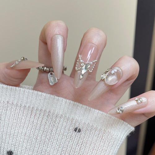 Elegant Stiletto Press-On Nail Art with Rhinestone and Pearl Accents Bowlift