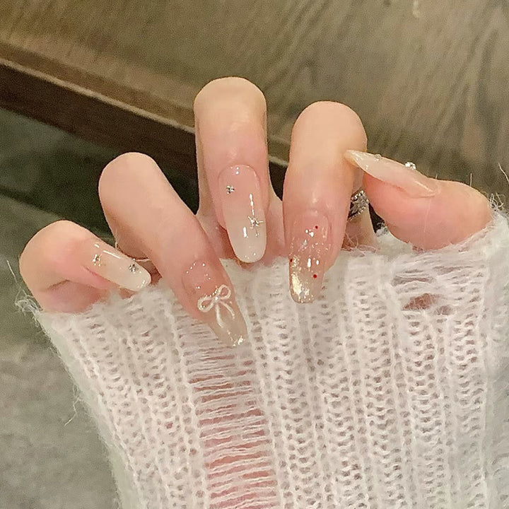 Elegant Press-On Nail Set with Artistic Detailing Bowlift