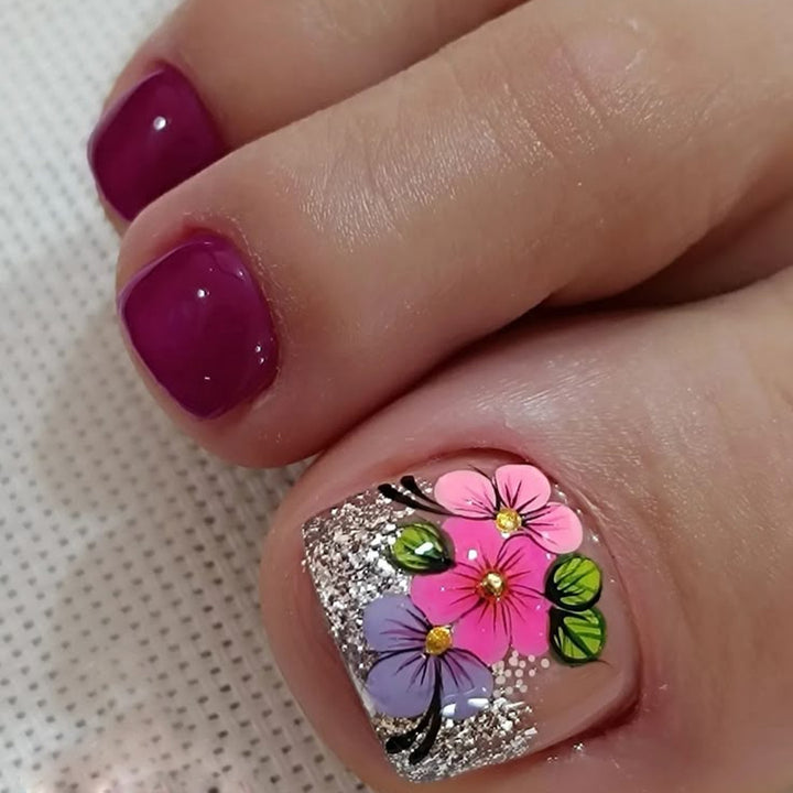 Artificial nails with floral designs and glitter effects Bowlift