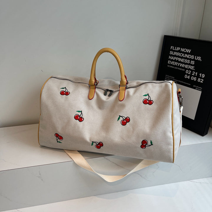 Sporty weekend bag with playful cherry pattern Bowlift