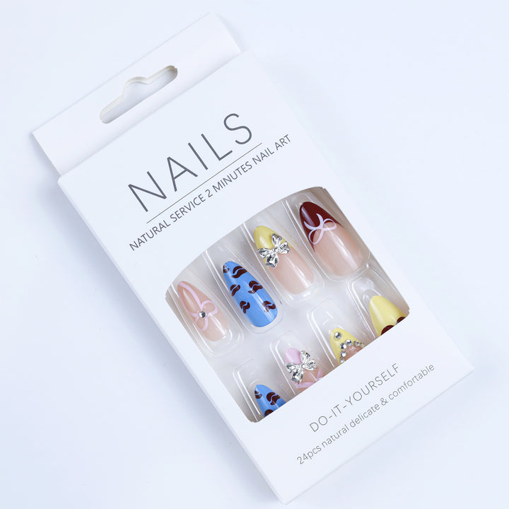 Artificial nails with playful design and 3D embellishments Bowlift