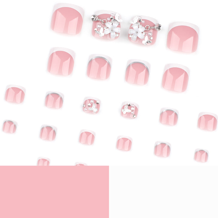 Artful toenail design with elegant flower and glitter accents Bowlift
