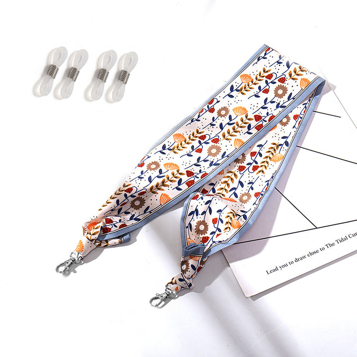 Fashionable fabric mask holder with floral motifs Bowlift