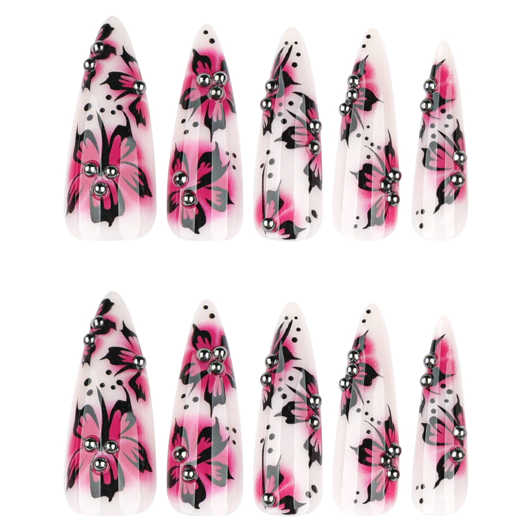 Artful nail art with floral design and rhinestone accents Bowlift