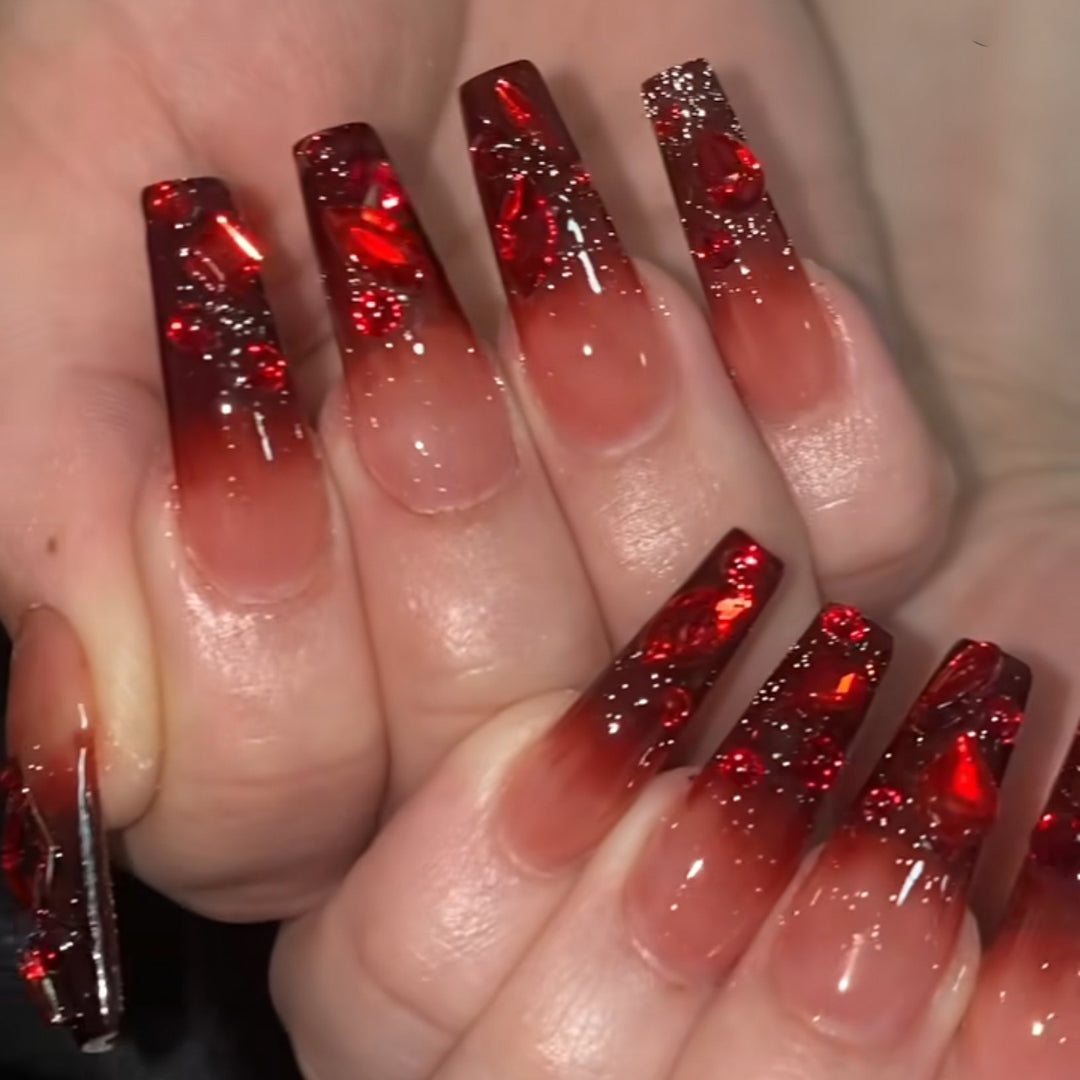 Creative Stiletto Nail Art with Blood Red Accents Bowlift