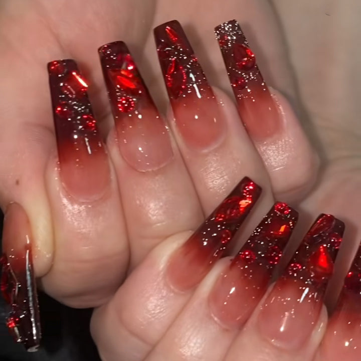 Creative Stiletto Nail Art with Blood Red Accents Bowlift