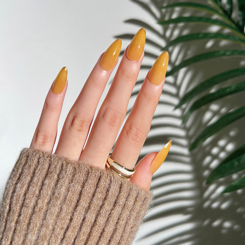 Artificial stiletto nails with glamorous glitter accent Bowlift