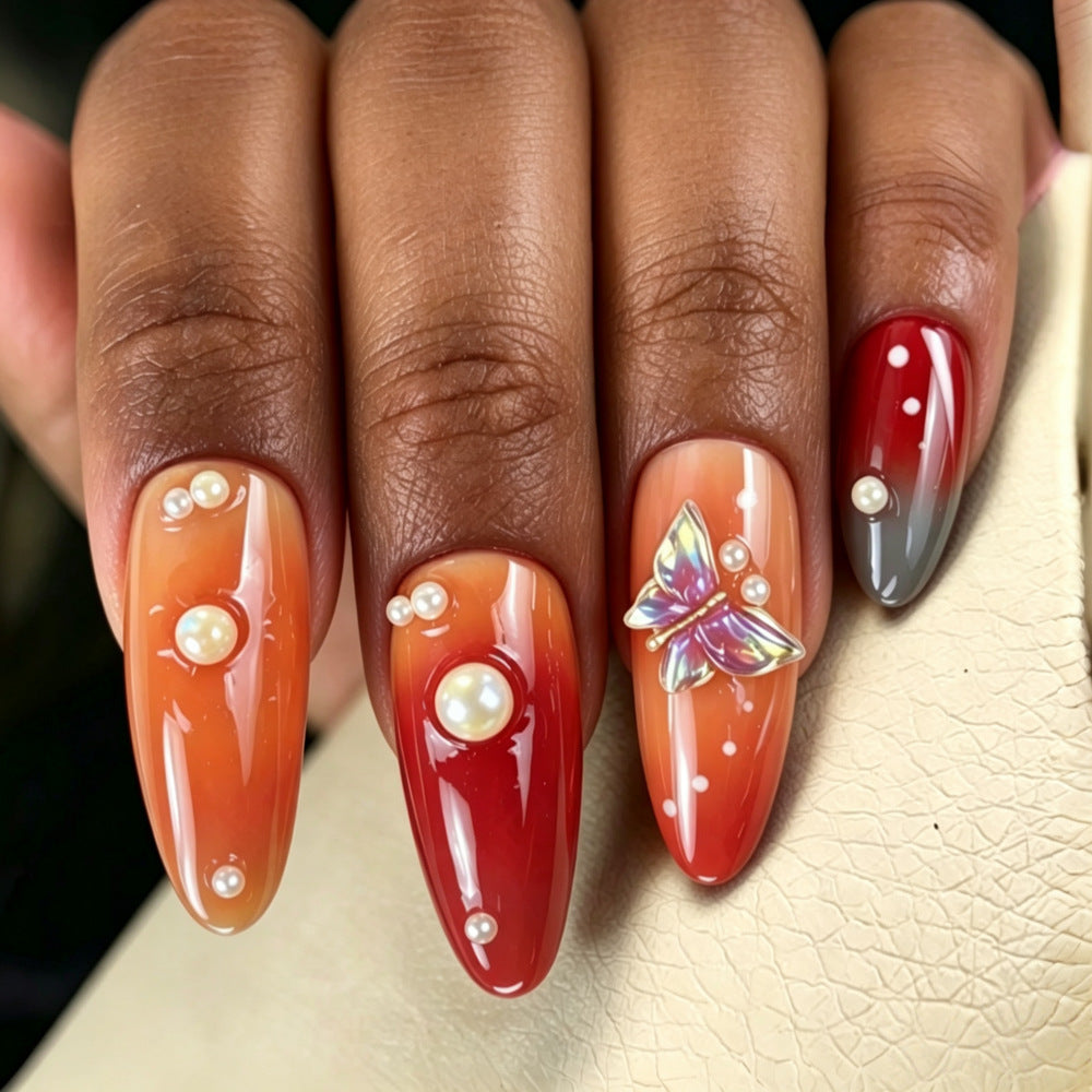Artful nail art with pearls and butterfly details Bowlift