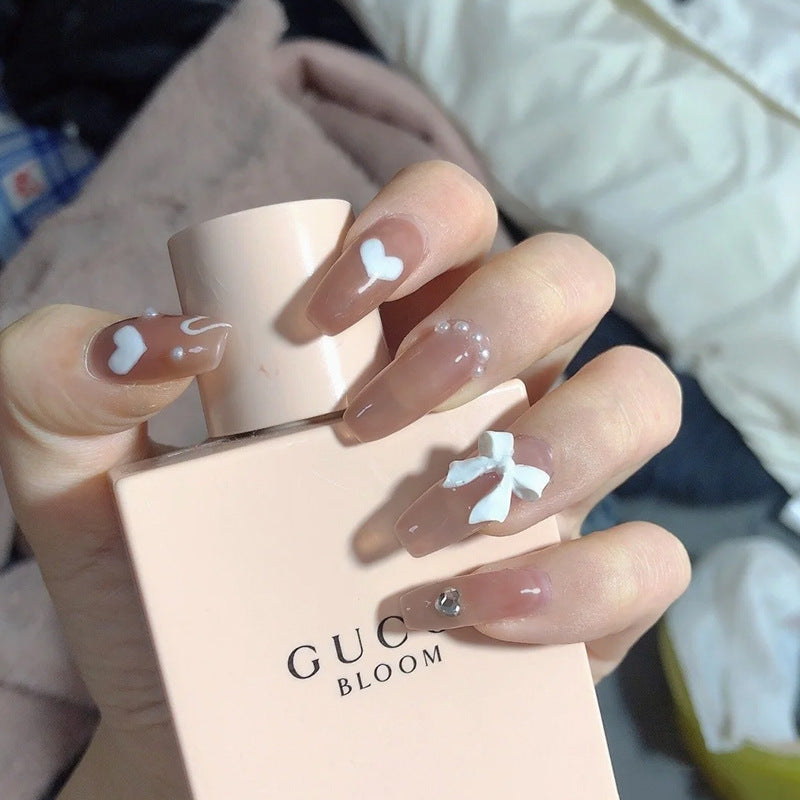 Artificial nails with heart accent and glamorous decorations Bowlift