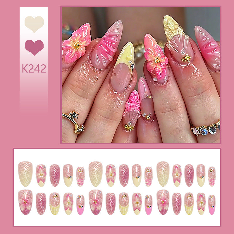 Art nail set with filigree flower decorations and glitter elements Bowlift