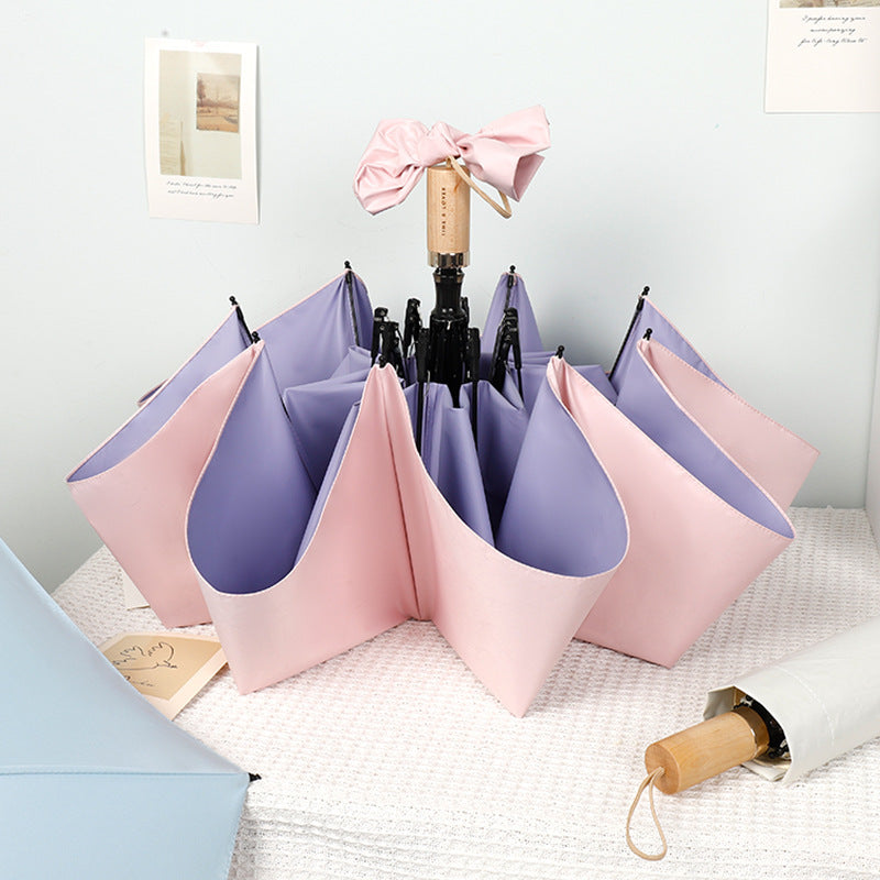 Women compact folding umbrella with stylish design and practical carrying strap Bowlift