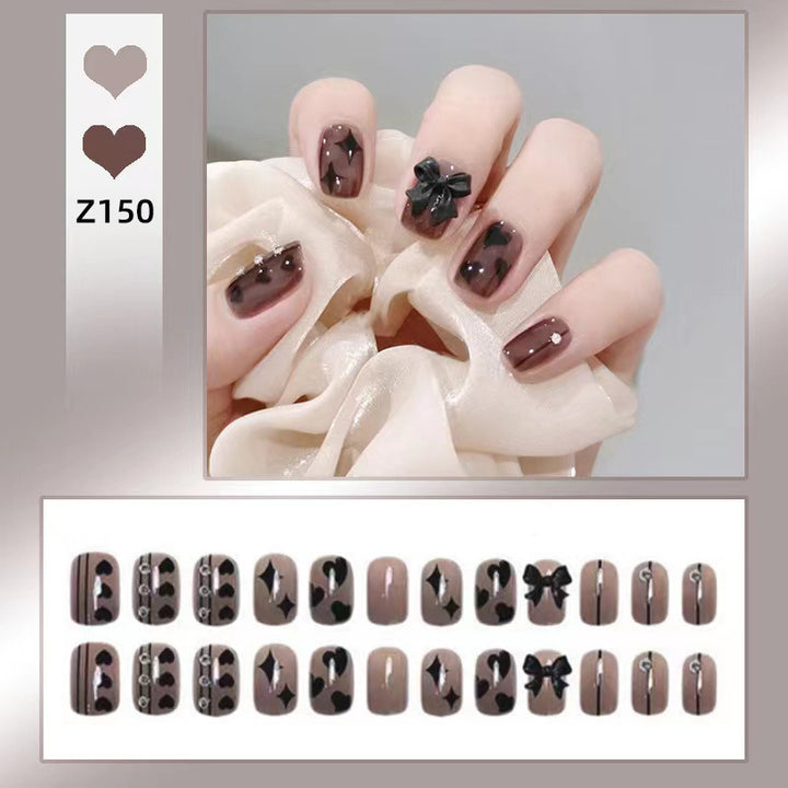 Artificial nails with elegant ribbon and heart designs Bowlift