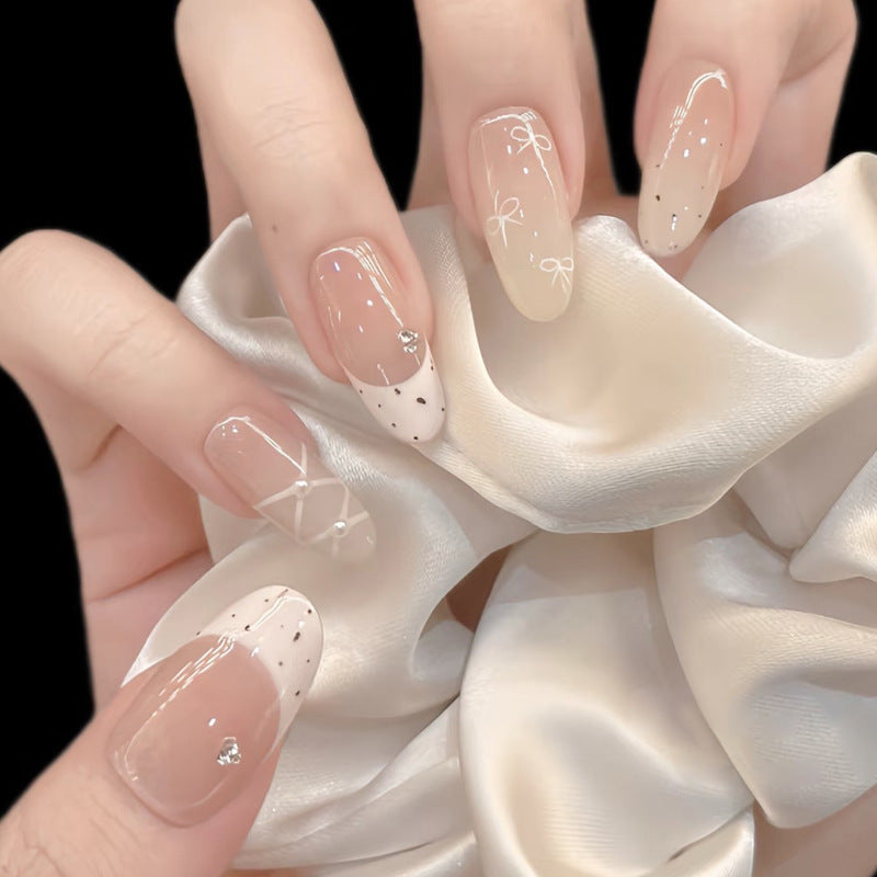 Elegant Press-On Nail Set with Artistic Detailing Bowlift