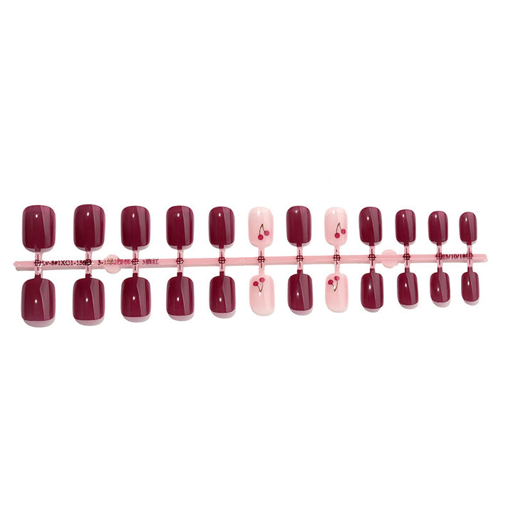Elegant Press-On Nail Set with Cherry Accent Design Bowlift