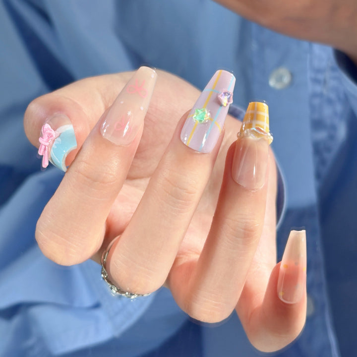 Artistic Press-On Nail Set with Whimsical Designs Bowlift