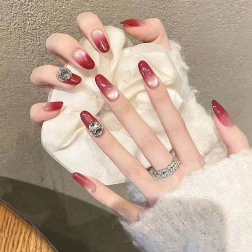 Artificial nails with elegant ombre effect and rhinestone decoration Bowlift