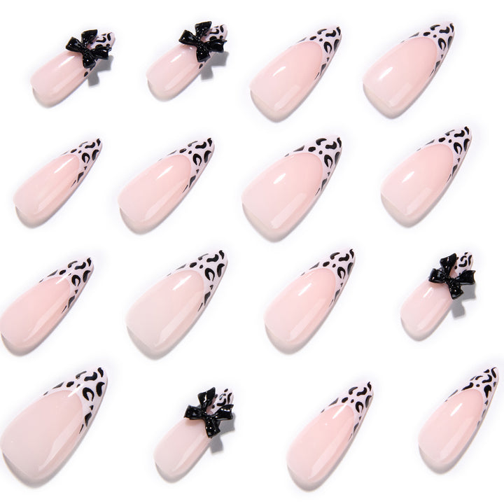 Artful Stiletto Nails with Leopard Print and Bow Accent Bowlift