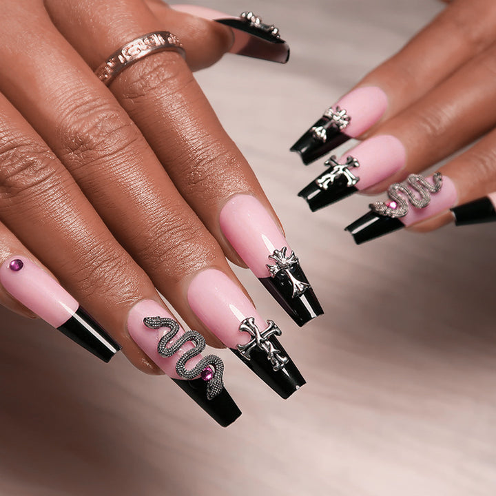 Artful stiletto nails with glitter accents and creative design Bowlift