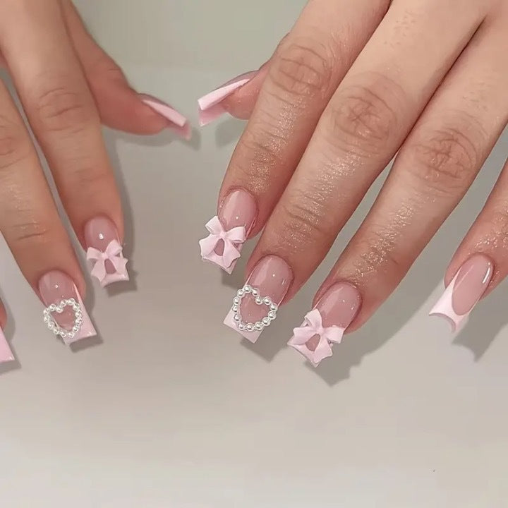Artificial nail set with 3D bows and pearl accents Bowlift
