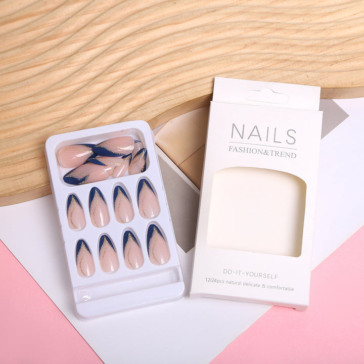 Artistic Nail Design with Elegant Golden Accents Bowlift
