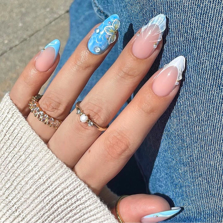 Artistic nail art with floral design and glitter Bowlift