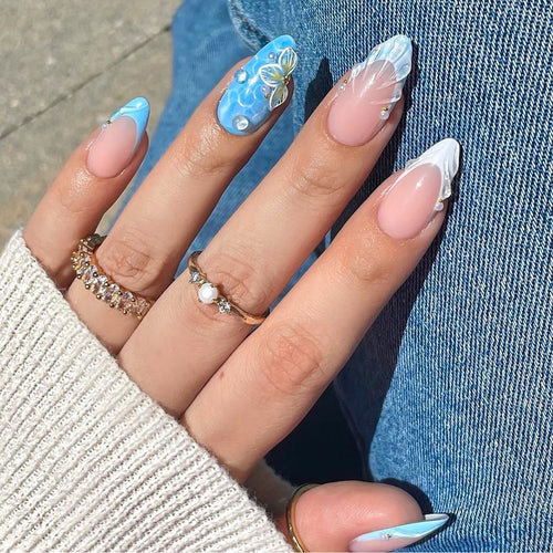Artistic nail art with floral design and glitter Bowlift