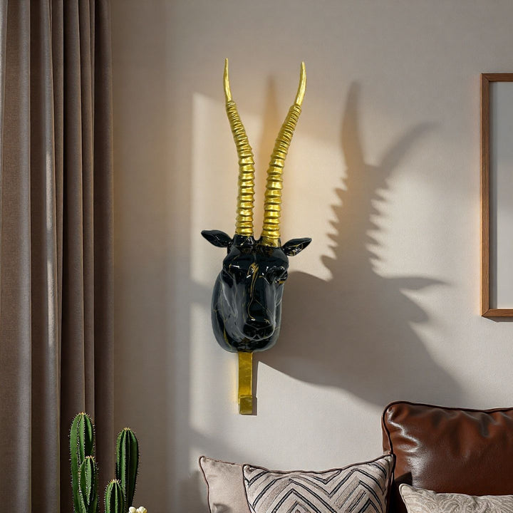 Wall hooks in the shape of a stylized unicorn Bowlift